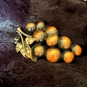 Grape bunch pin  has a couple missing rhinestones. Listed as Halloween prop boho